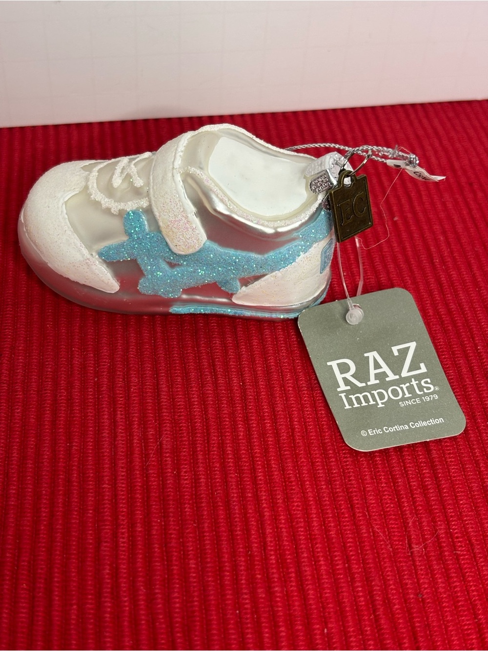 Eric Cortina Baby First Christmas White Shoe Ornament with Blue Accent